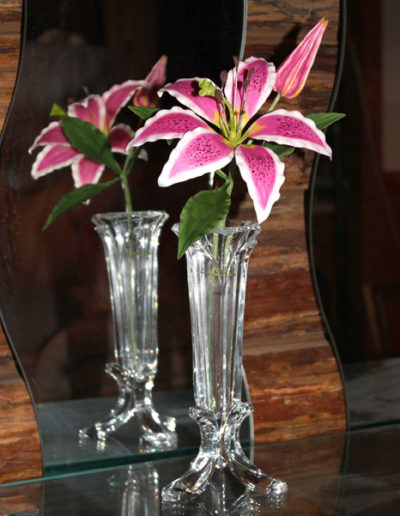 The Stargazer Lily. A sugar flower displayed in a glass bud vase.