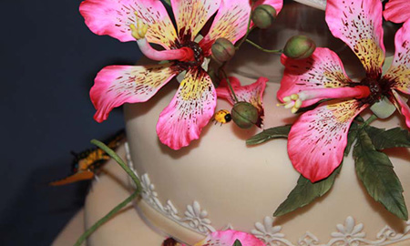 Edible sugar flowers on wedding cake.
